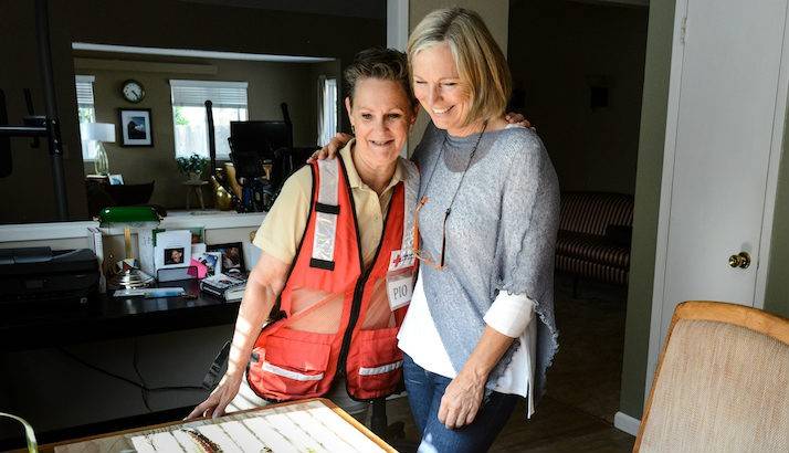 Tubbs Fire survivor Martha Menth shares her wildfire story with a Red Cross worker. 