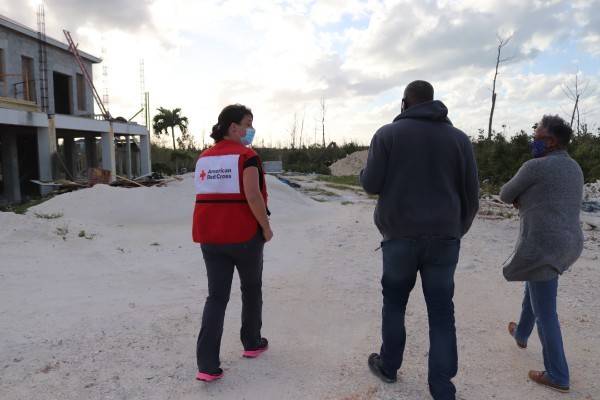 Bahamas residents show a Red Cross volunteer their progress in recovering from Hurricane Dorian