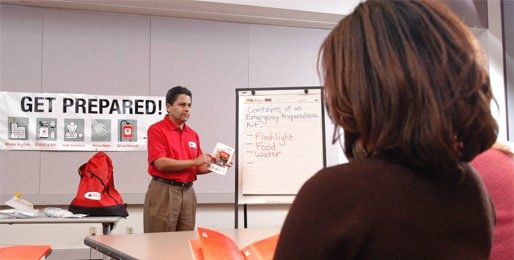 red crosser teaching in classroom