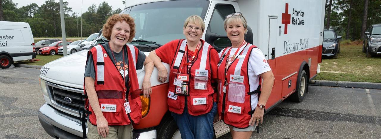 September 24, 2018. Hope Mills, North Carolina. Volunteers from kitchen six pose in front of their ERV. After spending lengthy emotional and rewarding days together on a team for two weeks, long lasting friendships form between volunteers. Photo by Daniel Cima/American Red Cross