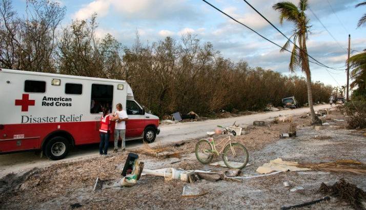 Red Cross volunteer Kelly speaks with a Hurricane Irma survivor during Red Cross hot meal delivery in Marathon, Florida.
