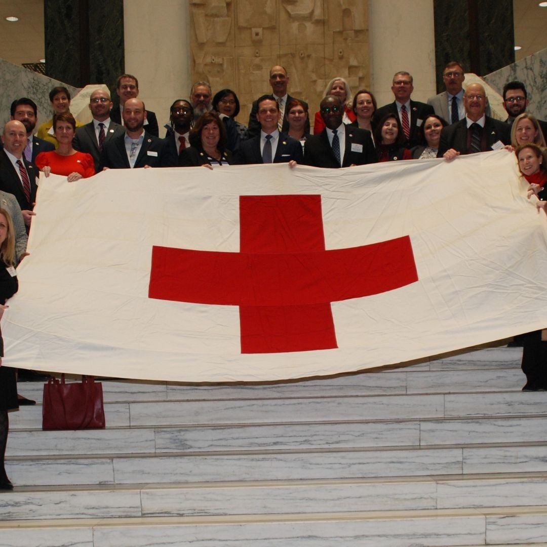 Eastern New york red crossers holding red cross flag